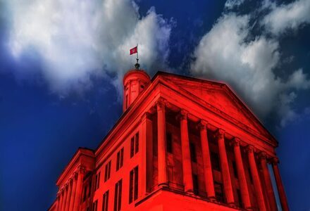 An illustration of a red-colored government building, which is representative of far-right extremism in Tennessee, which my story A darker shade of red is about.